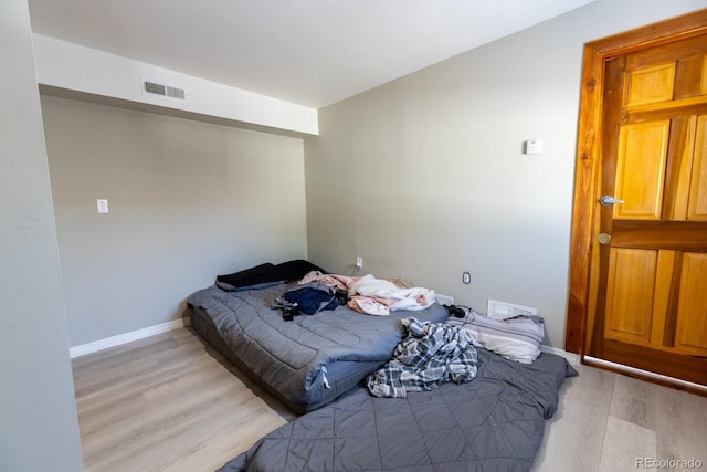 3021 Grape St, Denver, CO 80207 - bedroom featuring light wood finished floors and baseboards