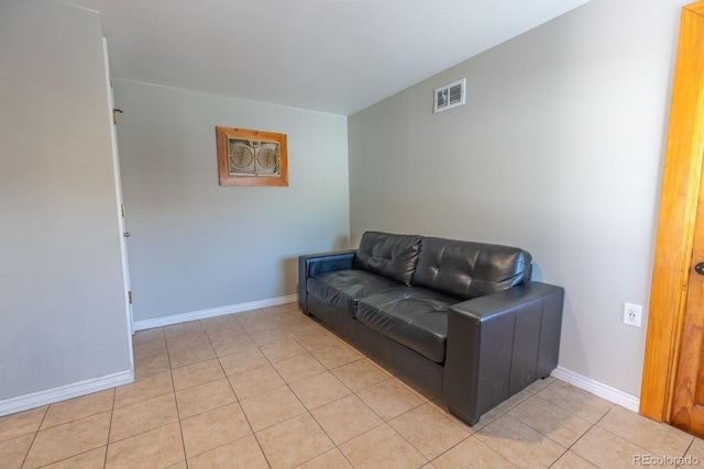 3021 Grape St, Denver, CO 80207 - living room featuring light tile patterned floors and baseboards