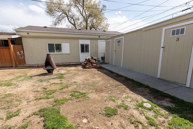3021 Grape St, Denver, CO 80207 - back of house featuring an outbuilding and fence
