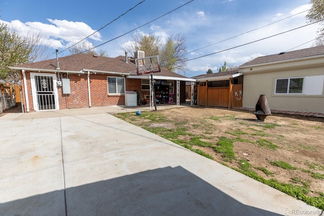 3021 Grape St, Denver, CO 80207 - rear view of house featuring brick siding and fence