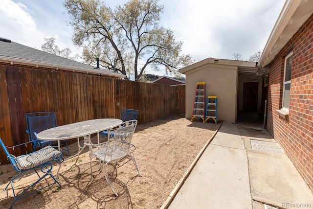 3021 Grape St, Denver, CO 80207 - view of patio featuring a fenced backyard and outdoor dining area