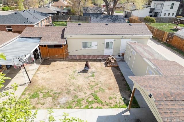 3021 Grape St, Denver, CO 80207 - back of house with a residential view and roof with shingles