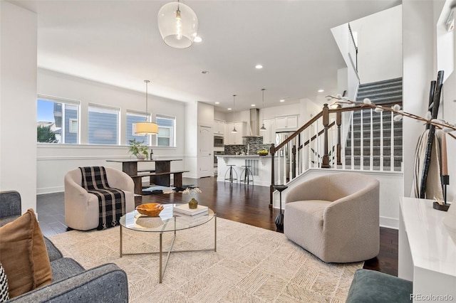 5068 Yosemite Ct, Denver, CO 80238 - living area featuring stairway, plenty of natural light, recessed lighting, and wood finished floors