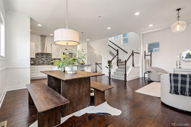 5068 Yosemite Ct, Denver, CO 80238 - dining space with dark wood-type flooring, stairway, and recessed lighting