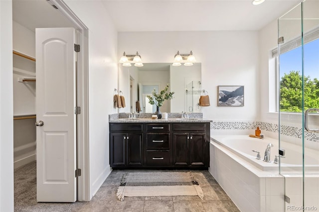 5068 Yosemite Ct, Denver, CO 80238 - full bathroom with double vanity, a garden tub, a walk in closet, and an enclosed shower