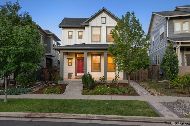 5068 Yosemite Ct, Denver, CO 80238 - view of front of house with board and batten siding and a porch