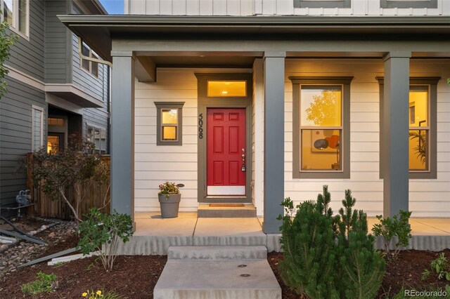 5068 Yosemite Ct, Denver, CO 80238 - property entrance with board and batten siding and covered porch