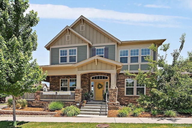5663 W 96th Ave, Westminster, CO 80020 - craftsman-style house featuring board and batten siding, covered porch, and stone siding
