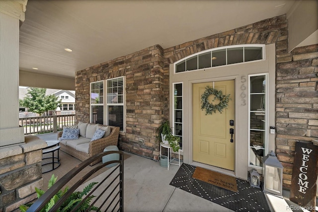 5663 W 96th Ave, Westminster, CO 80020 - doorway to property with stone siding and a porch