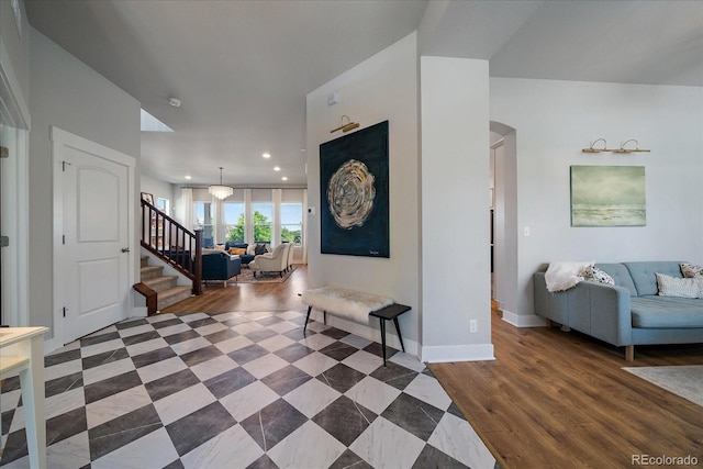 5663 W 96th Ave, Westminster, CO 80020 - foyer entrance featuring stairway, recessed lighting, arched walkways, and wood finished floors
