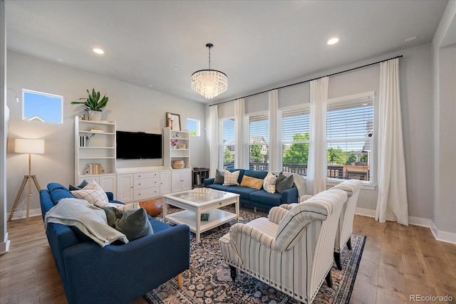 5663 W 96th Ave, Westminster, CO 80020 - living room with light wood-style floors, recessed lighting, and a chandelier