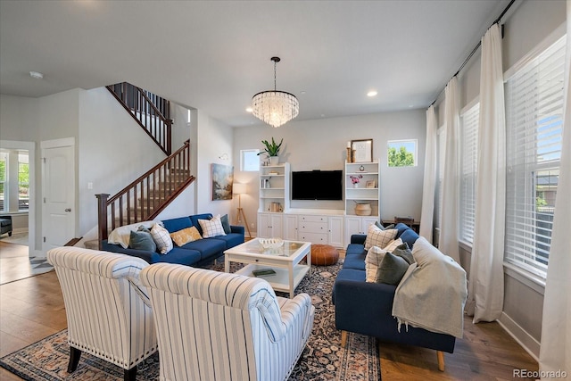 5663 W 96th Ave, Westminster, CO 80020 - living room featuring wood finished floors, stairs, a chandelier, and recessed lighting
