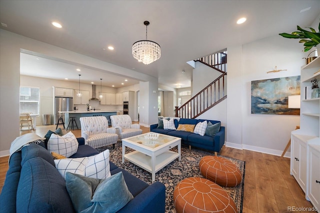 5663 W 96th Ave, Westminster, CO 80020 - living room with light wood-type flooring, a chandelier, stairway, and recessed lighting
