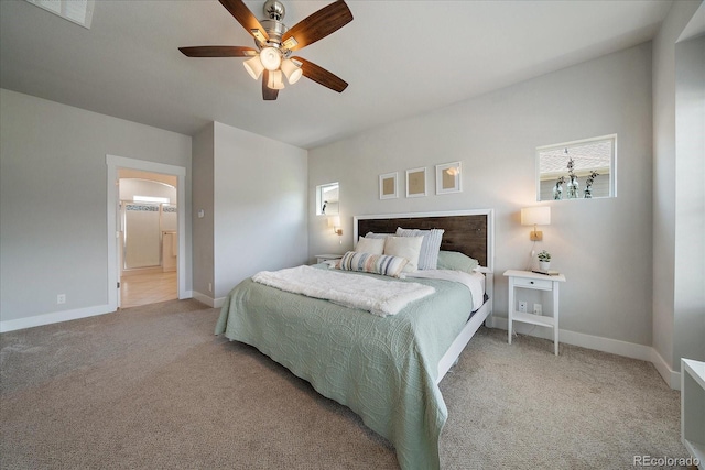 5663 W 96th Ave, Westminster, CO 80020 - bedroom with light carpet, ceiling fan, arched walkways, and ensuite bathroom
