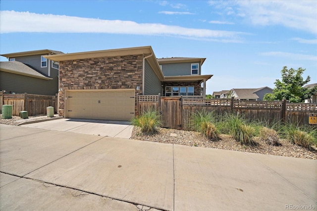5663 W 96th Ave, Westminster, CO 80020 - view of front facade featuring driveway and stone siding