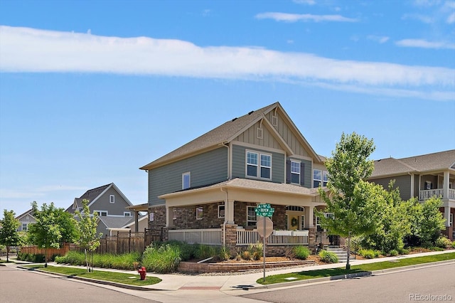 5663 W 96th Ave, Westminster, CO 80020 - craftsman house featuring board and batten siding, a porch, and stone siding