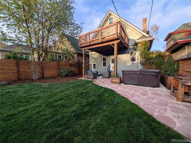back of property featuring a hot tub, outdoor lounge area, fence private yard, and a patio area