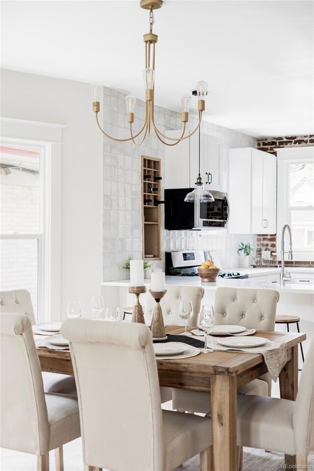 dining area featuring a notable chandelier