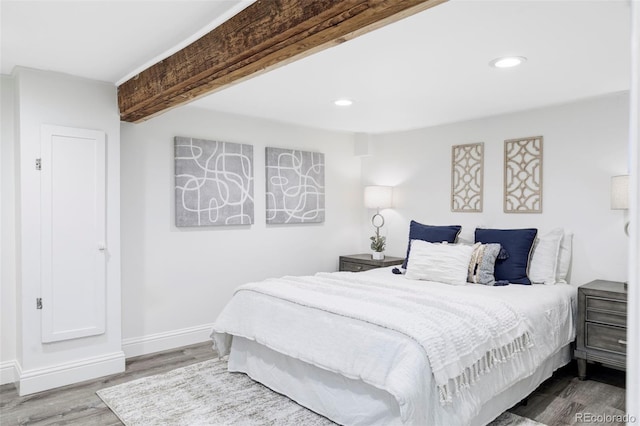 bedroom with baseboards, recessed lighting, and wood finished floors