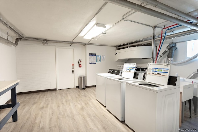 85 N Grant St Unit 27, Denver, CO 80203 - shared laundry with washer and dryer and light wood-style floors