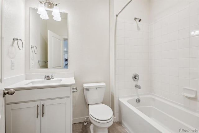 27684 E Byers Ave, Aurora, CO 80018 - bathroom featuring toilet, tub / shower combination, vanity, and baseboards