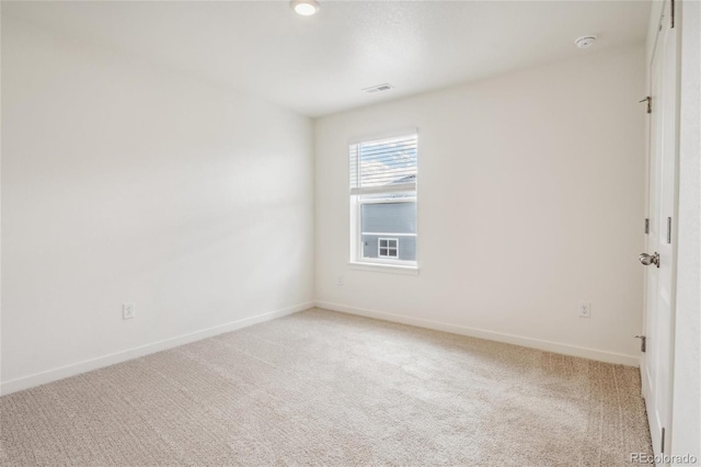 27684 E Byers Ave, Aurora, CO 80018 - spare room featuring light colored carpet, baseboards, and a smoke detector