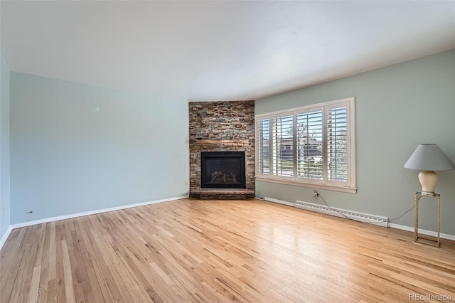 8095 E Lehigh Ave, Denver, CO 80237 - unfurnished living room featuring a baseboard heating unit, wood finished floors, baseboards, and a fireplace