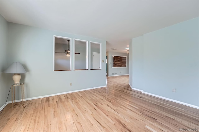 8095 E Lehigh Ave, Denver, CO 80237 - empty room featuring wood finished floors, ceiling fan, and baseboards