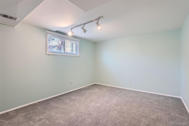8095 E Lehigh Ave, Denver, CO 80237 - basement featuring rail lighting, carpet flooring, and baseboards