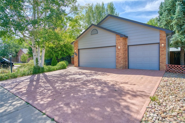 view of front of property with a garage and an outdoor structure