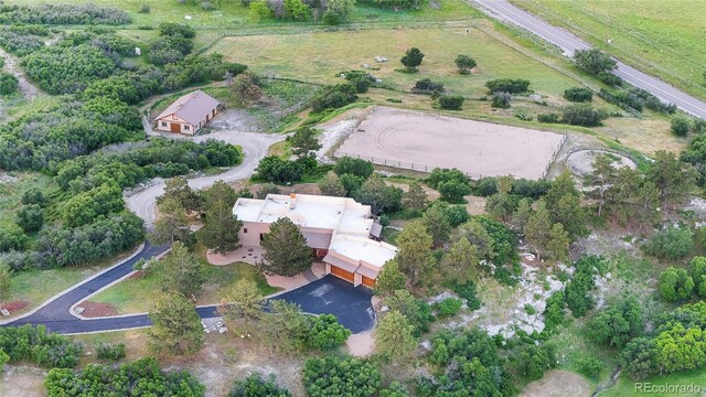 birds eye view of property featuring a rural view