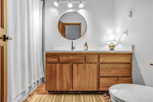 23646 Genesee Village Rd, Golden, CO 80401 - bathroom with vanity, toilet, curtained shower, and tile patterned floors