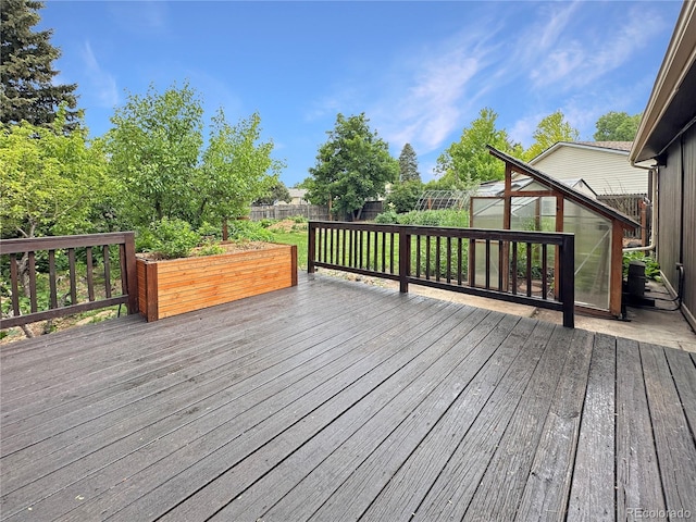 9236 W Euclid Ave, Littleton, CO 80123 - deck featuring a greenhouse, a fenced backyard, and an outdoor structure