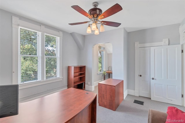 office space featuring light colored carpet and ceiling fan