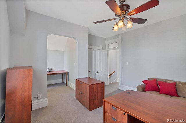 bedroom featuring a closet, ceiling fan, and light carpet