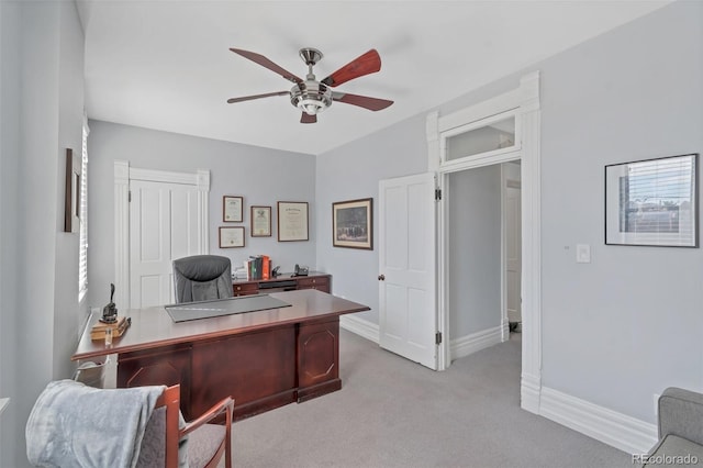 carpeted office with ceiling fan