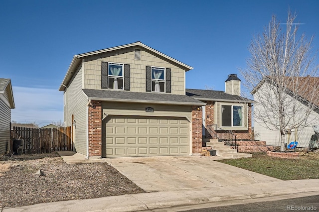 view of front of property featuring concrete driveway, a garage, fence, and brick siding