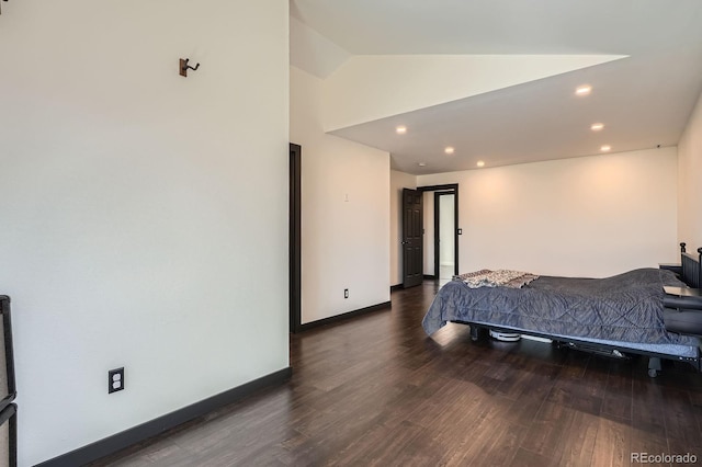 bedroom with recessed lighting, baseboards, lofted ceiling, and wood finished floors