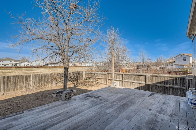 deck with a fenced backyard