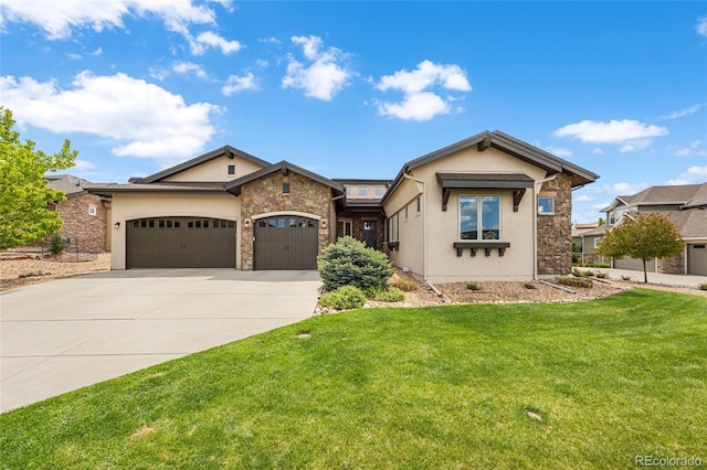 view of front of home featuring a garage and a front lawn