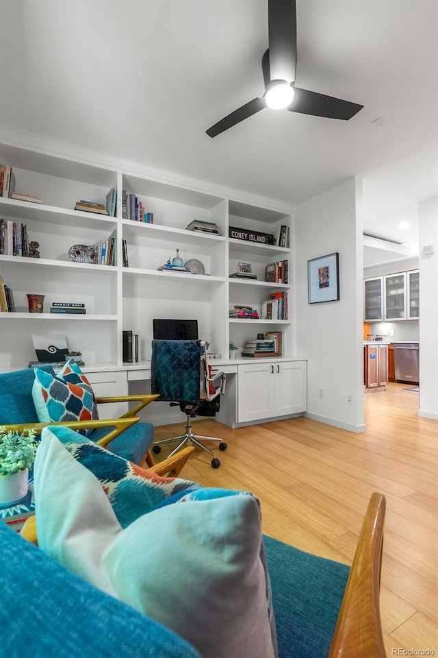 350 Holly St, Denver, CO 80220 - living room featuring light wood-style flooring, a ceiling fan, and a desk