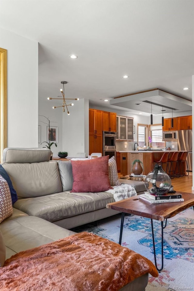 350 Holly St, Denver, CO 80220 - living room with recessed lighting and a chandelier