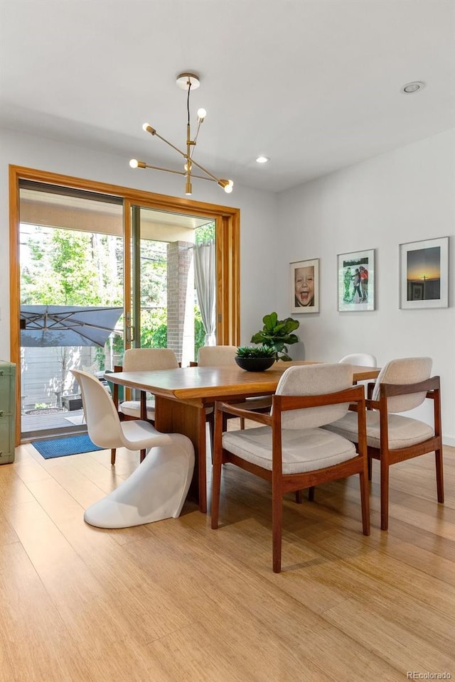 350 Holly St, Denver, CO 80220 - dining room featuring light wood finished floors, a chandelier, and recessed lighting