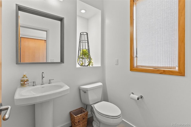 350 Holly St, Denver, CO 80220 - half bathroom with toilet and baseboards