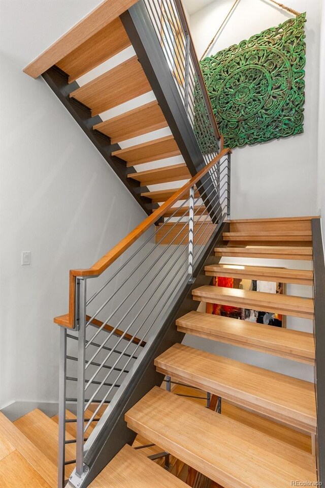 350 Holly St, Denver, CO 80220 - staircase featuring wood finished floors