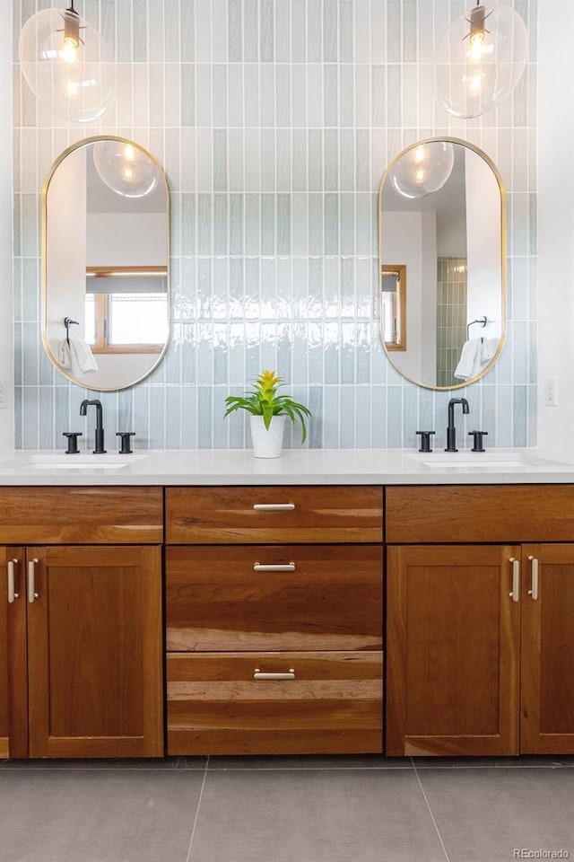 350 Holly St, Denver, CO 80220 - full bathroom featuring double vanity, backsplash, tile patterned floors, and tile walls