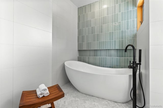 350 Holly St, Denver, CO 80220 - bathroom with tile walls and a freestanding tub