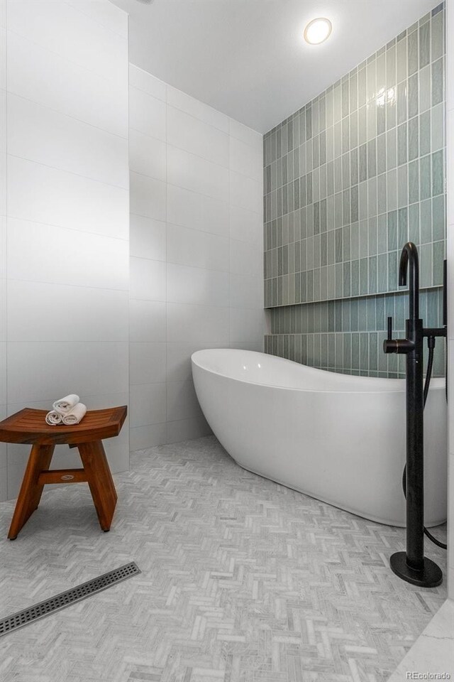 350 Holly St, Denver, CO 80220 - full bathroom with tile walls and a soaking tub