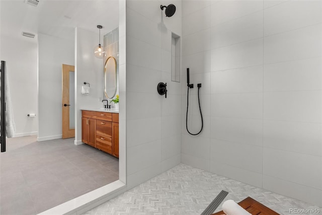 350 Holly St, Denver, CO 80220 - bathroom with tiled shower and vanity