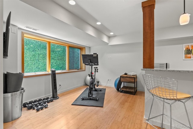 350 Holly St, Denver, CO 80220 - workout room featuring wood finished floors, recessed lighting, and baseboards